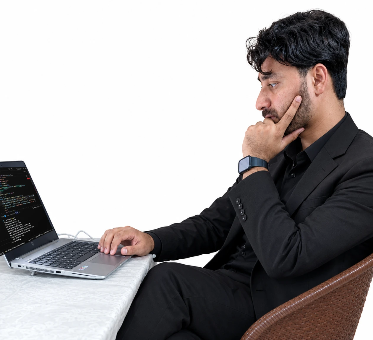 Muhammad Niaz Ali working on his laptop